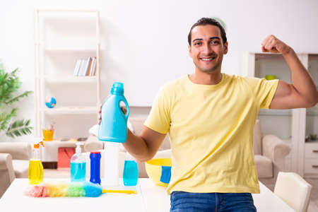 Young male contractor doing housework at homeの写真素材