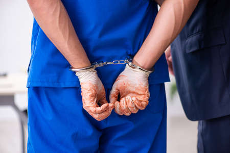 Male doctor in courthouse meeting with advocateの写真素材