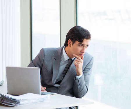 Young successful businessman working at the officeの写真素材