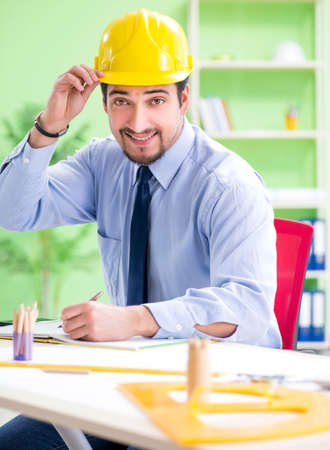 Young male architect working at the projectの写真素材