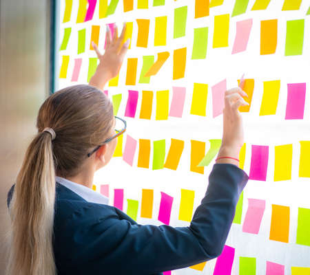 Beautiful female employee with many conflicting prioritiesの写真素材