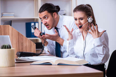 Call center operators working in the officeの写真素材