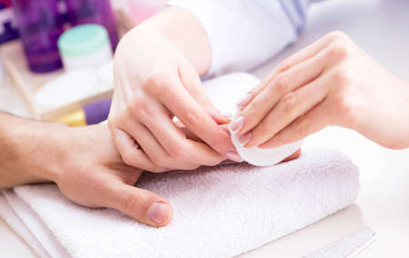 Hands during manicure care sessionの写真素材