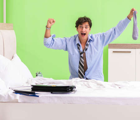 Young businessman employee late for officeの写真素材