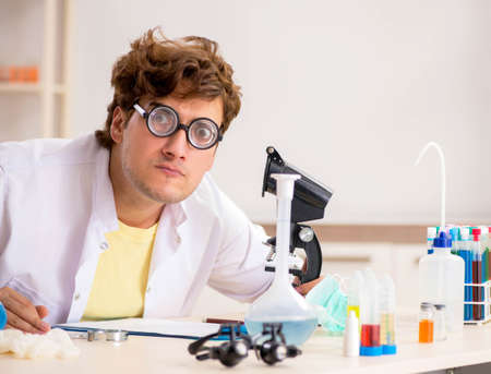 Funny crazy chemist doing experiments and testsの写真素材