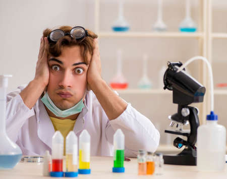 Funny crazy chemist doing experiments and testsの写真素材