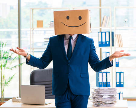 The happy man with box instead of his headの写真素材
