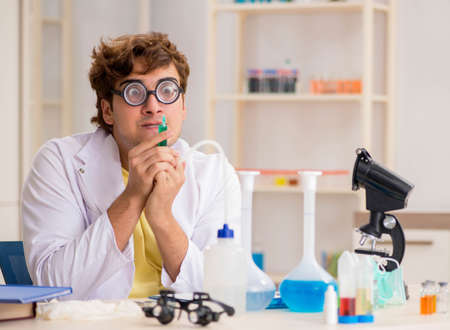 Funny crazy chemist doing experiments and testsの写真素材