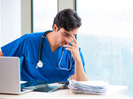 The young handsome doctor working in the hospitalの写真素材