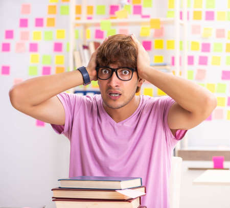 Student preparing for exams with many conflicting prioritiesの写真素材