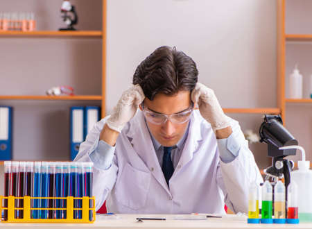 The young handsome biochemist working in the labの写真素材