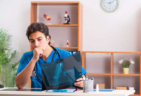 Young handsome doctor radiologyst working in clinicの写真素材