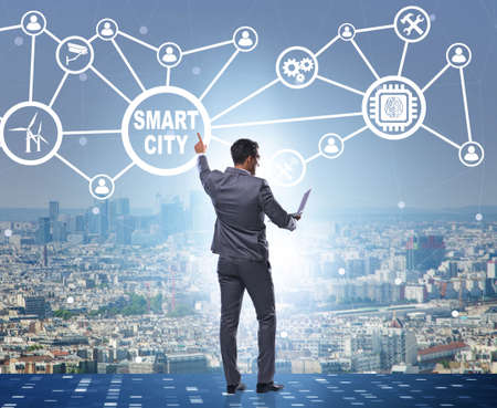 Concept of smart city with businessman pressing buttonsの写真素材