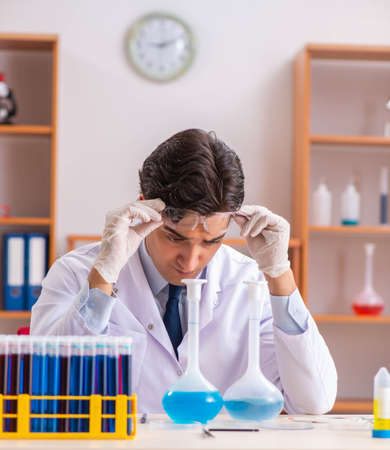 The young handsome biochemist working in the labの写真素材