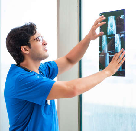 Young handsome doctor working in the hospitalの写真素材