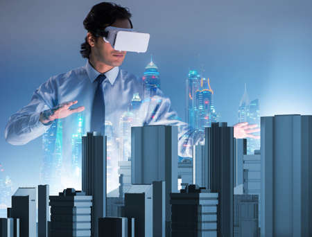 The man with virtual reality goggles doing urban planning