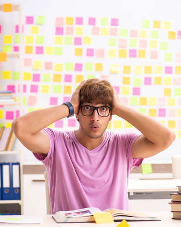 Student preparing for exams with many conflicting prioritiesの写真素材