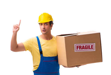 Young contractor with fragile boxes isolated on whiteの写真素材