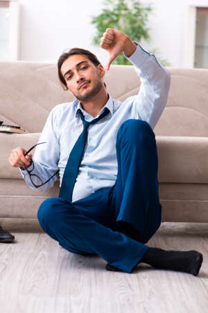 Young male businessman working at homeの写真素材