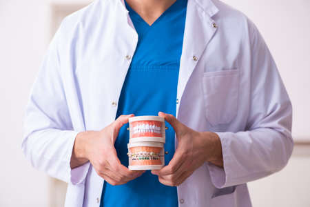 Young dentist working in the clinicの写真素材