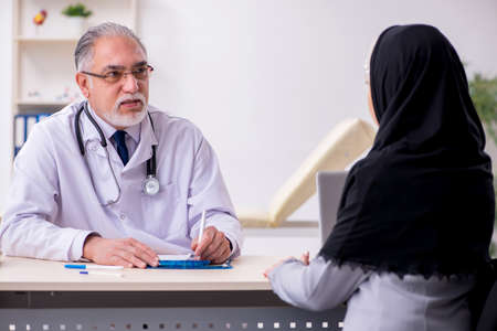 Arab woman visiting experienced doctorの写真素材