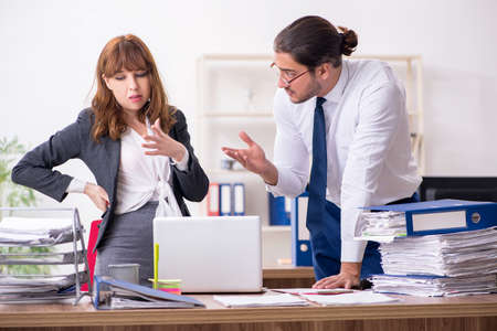 Two employees working in the officeの写真素材