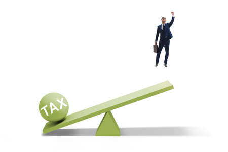 Businessman in tax concept with seesawの写真素材