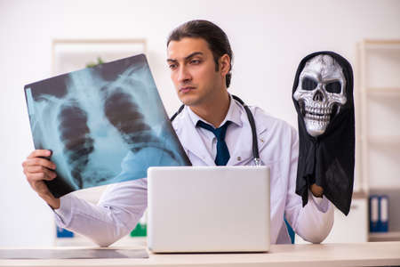 Male devil doctor radiologist working in the clinicの写真素材