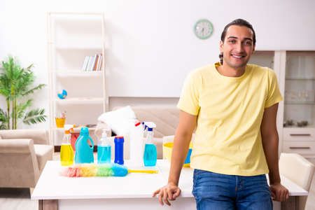 Young male contractor doing housework at homeの写真素材