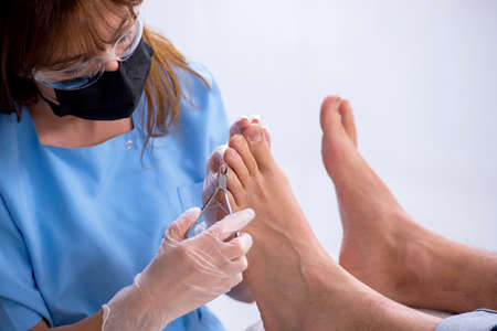 Podiatrist treating feet during the procedureの写真素材