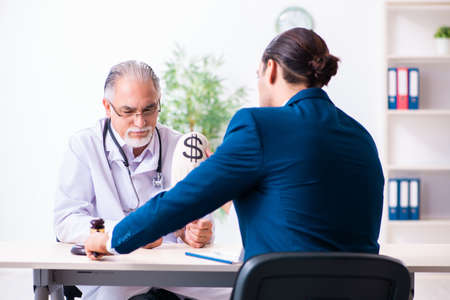 Male doctor in courthouse meeting with lawyerの写真素材