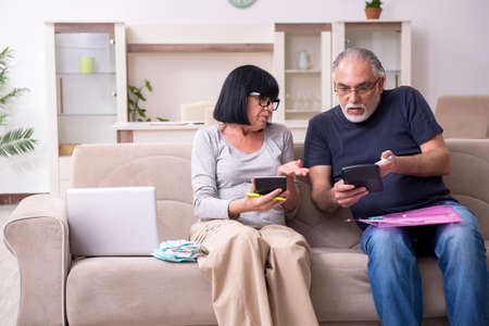Old couple discussing family finances