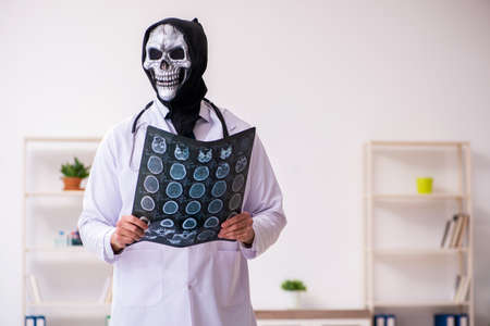 Male devil doctor radiologist working in the clinicの写真素材