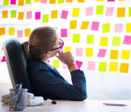 Beautiful female employee with many conflicting priorities
