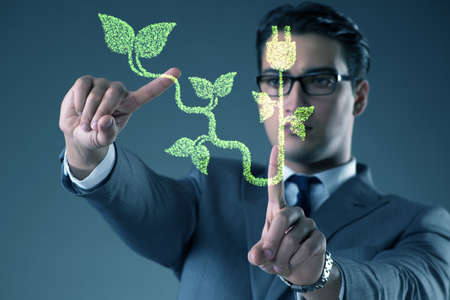 Green energy concept with businessmanの写真素材