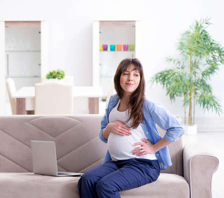 Pregnant woman relaxing on the sofa