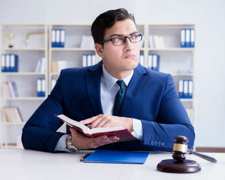 Lawyer working in his officeの写真素材