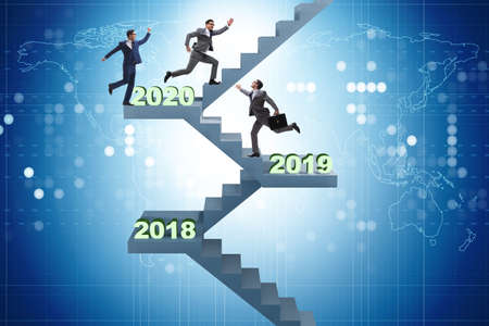 Businessman climbing stairs on yearly basis