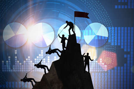 Concept of teamwork with team climbing mountainの写真素材