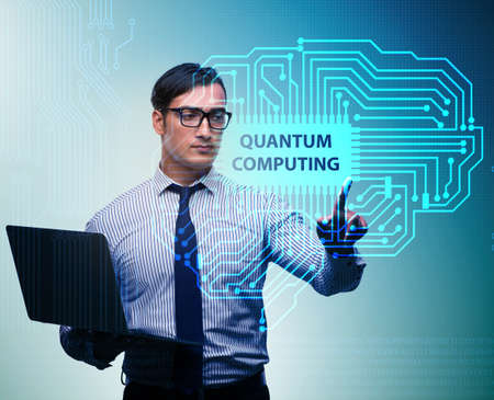 Businessman pressing virtual button in quantum computing conceptの写真素材