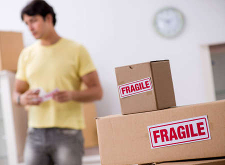 The man moving house and relocating with fragile items