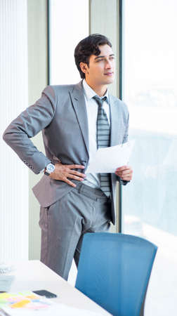 Young successful businessman working at the office