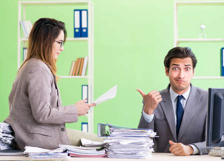 Two colleagues working in the officeの写真素材