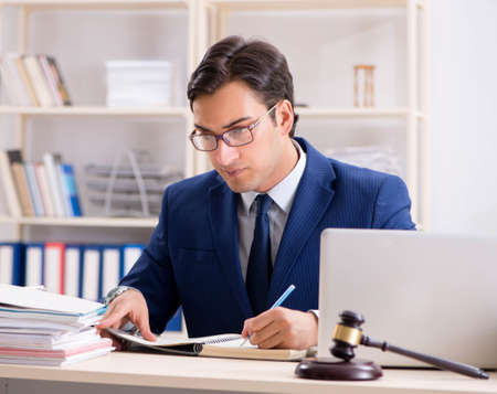 Young handsome judge working in courtの写真素材