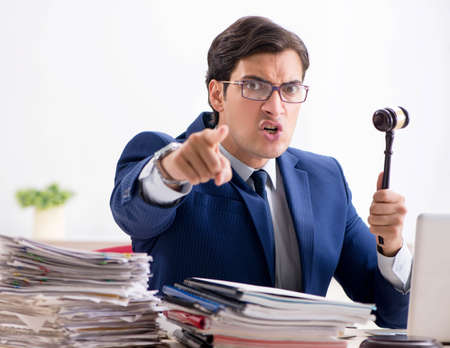 Young handsome judge working in courtの写真素材