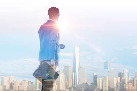 Successful businessman against cityscape in business concept