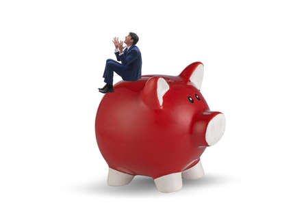 Businessman in debt concept with piggybankの写真素材