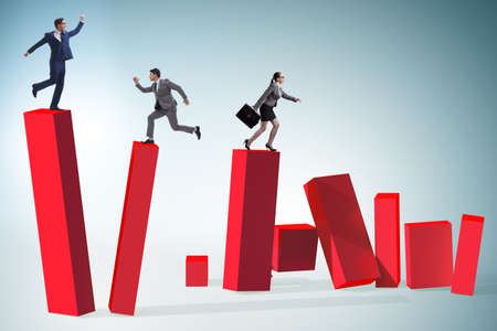 Business people in a collapsing economy conceptの写真素材