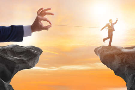 Boss holding his employee in retention conceptの写真素材