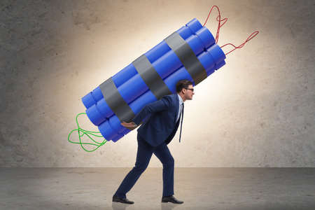 Desperate businessman with dynamite sticks